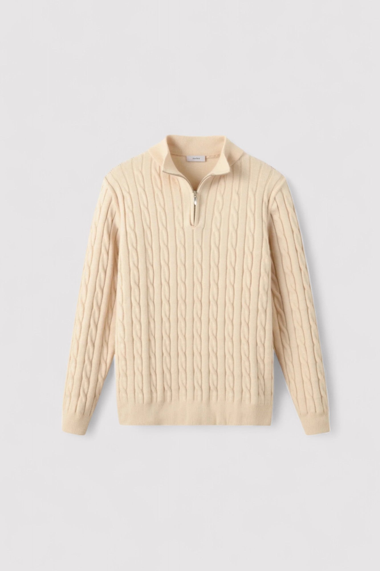 A cream knit cardigan and chunky cable knit sweater for men