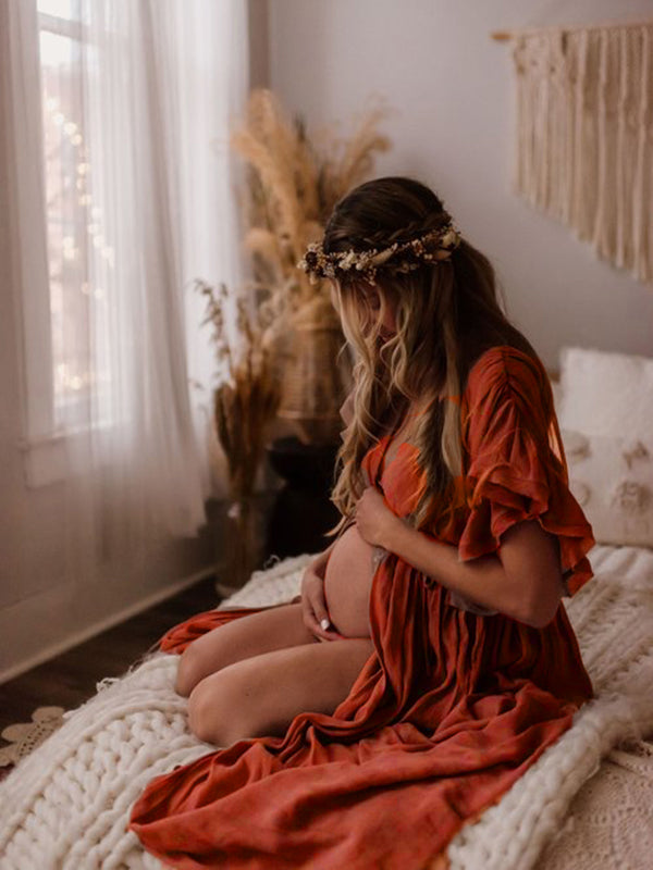 A stylish maternity maxi dress ideal for photoshoots and pregnancy parties