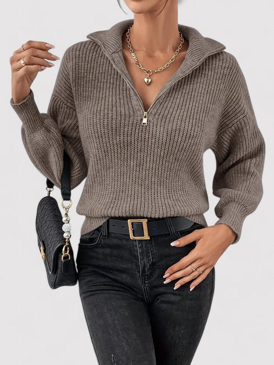 An elegant women's half zip sweater, part of a stylish and sophisticated clothing range