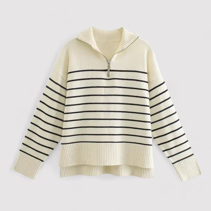 Collection of women's knit sweaters, including white, cream and blue styles