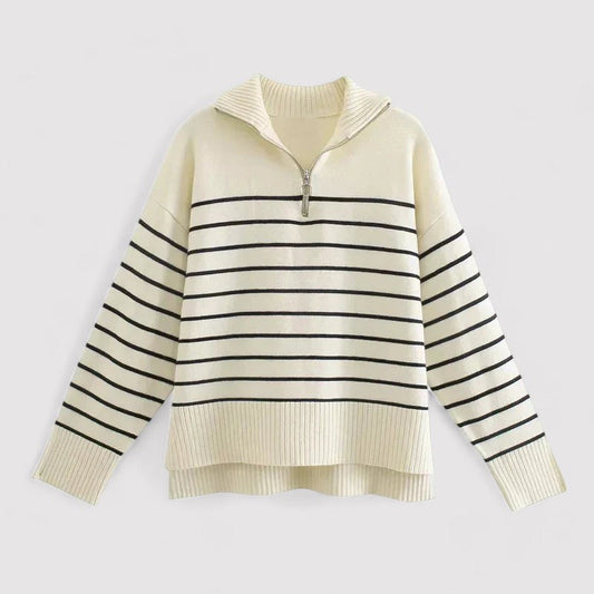 Collection of women's knit sweaters, including white, cream and blue styles